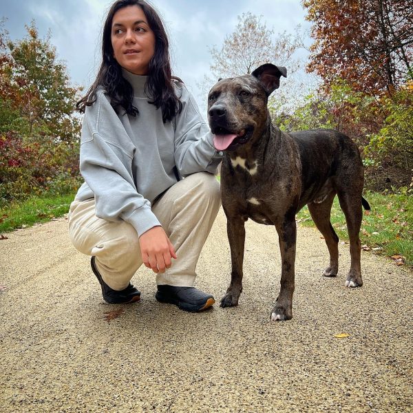 A female singer with her dog